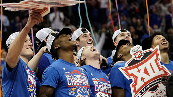 Kansas players celebrate the Big 12 tournament title